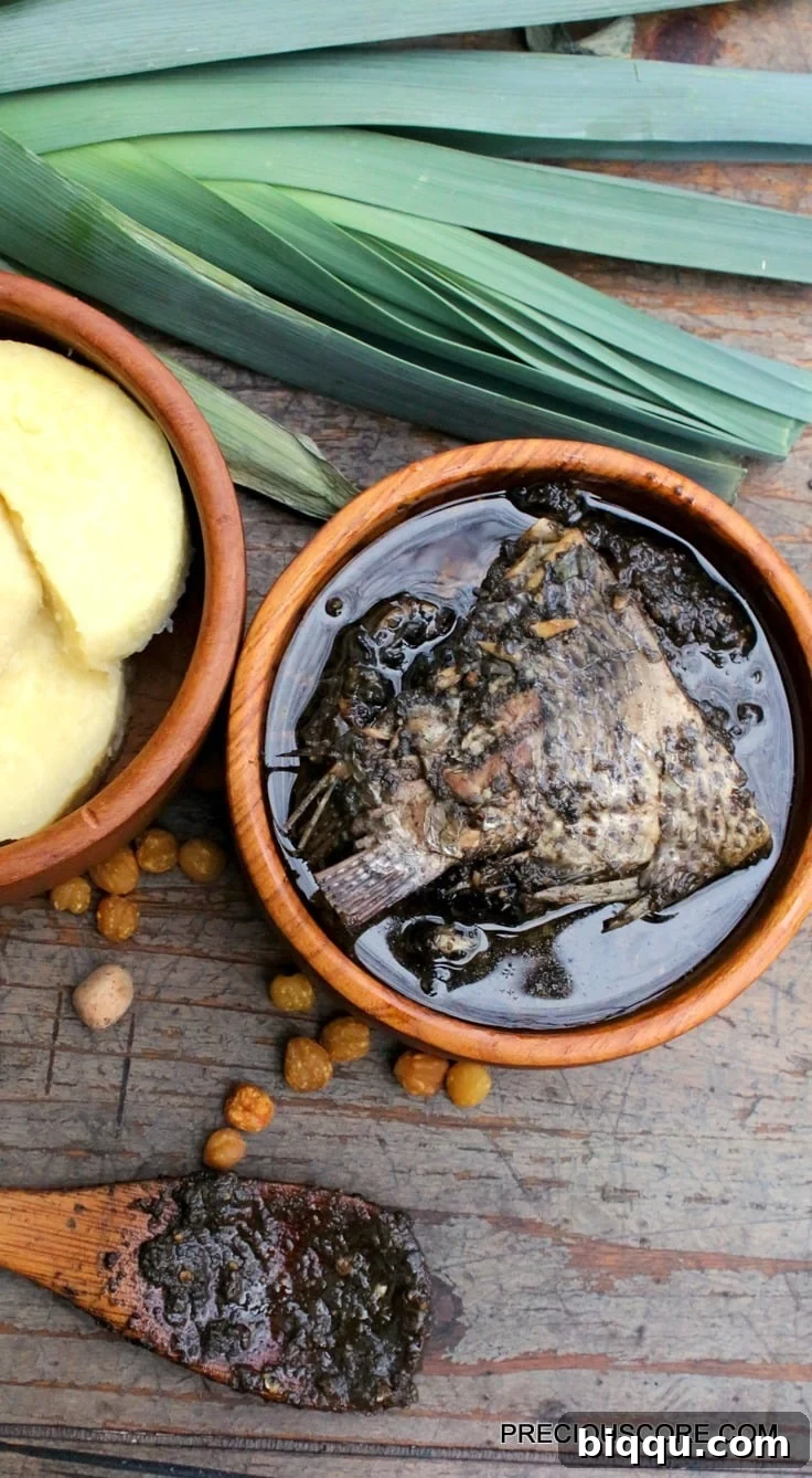Authentic Mbongo Tchobi Cameroonian Black Stew served with yam