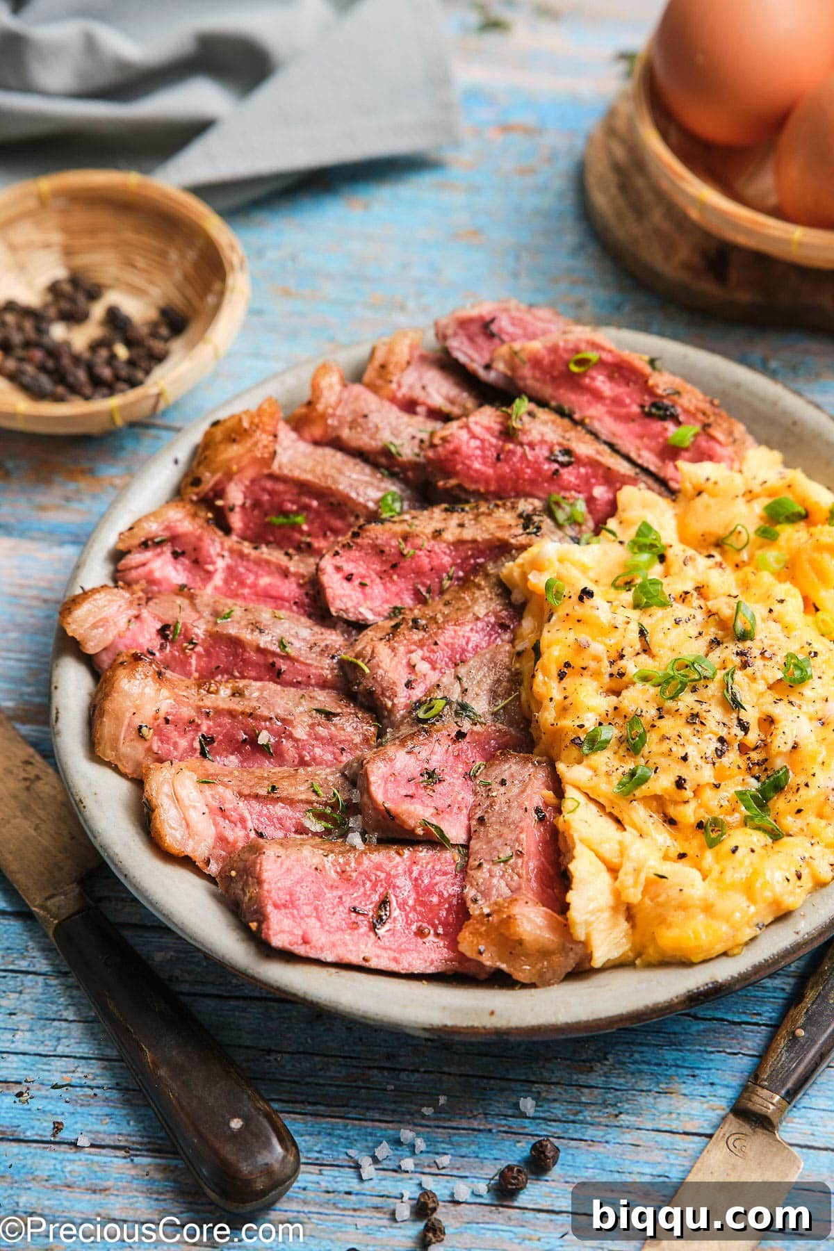A close-up shot of a gourmet homemade steak and eggs meal, highlighting the texture and perfect presentation.