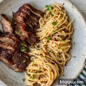 Steak and Pasta with homemade garlic cream sauce.