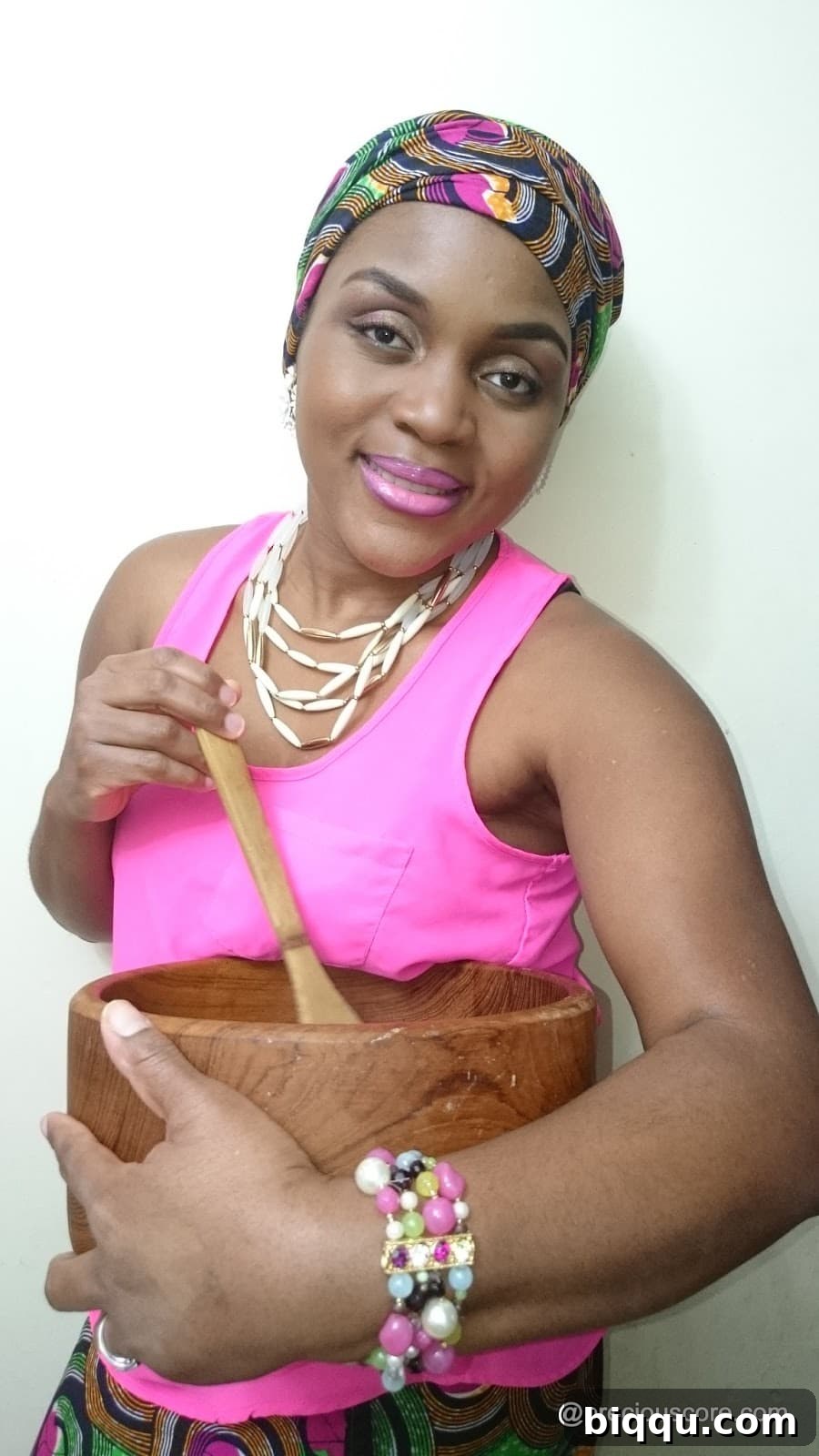 Woman smiling warmly, potentially a banner image for a cooking YouTube channel, radiating approachability.