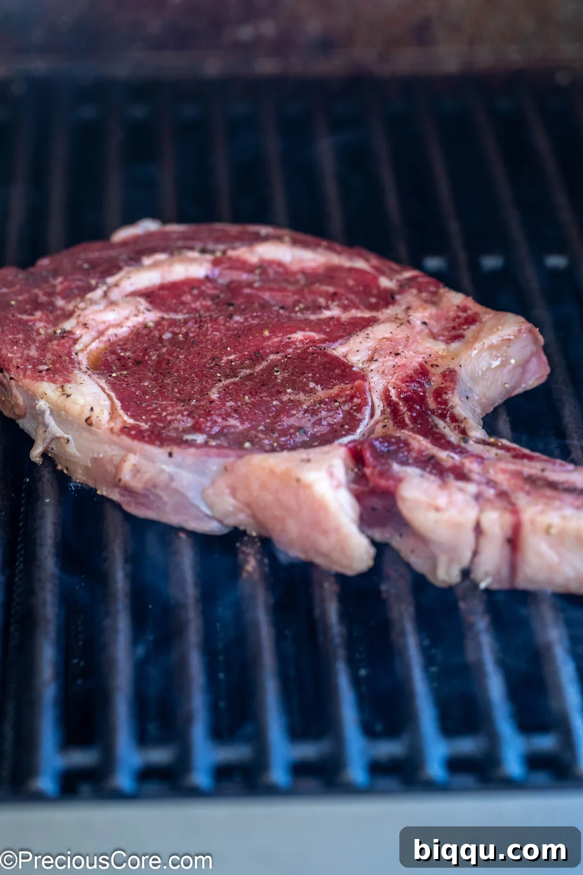 Grilling steak on outside grill.