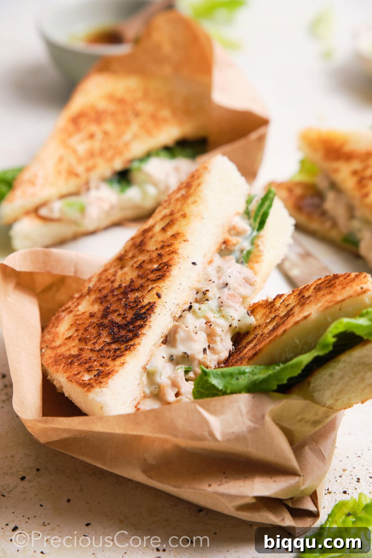 Sandwich wrapped in sandwich paper.