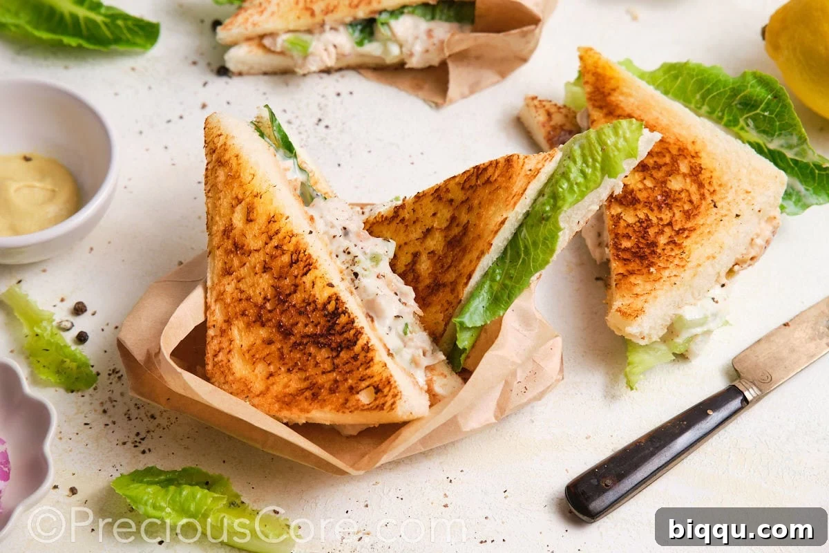 Served sandwiches wrapped in parchment paper.