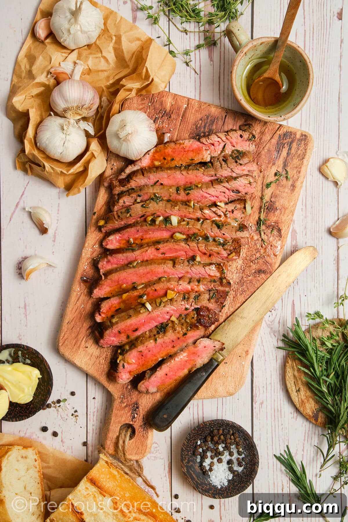 Cooked steak with other ingredients around, suggesting serving options.