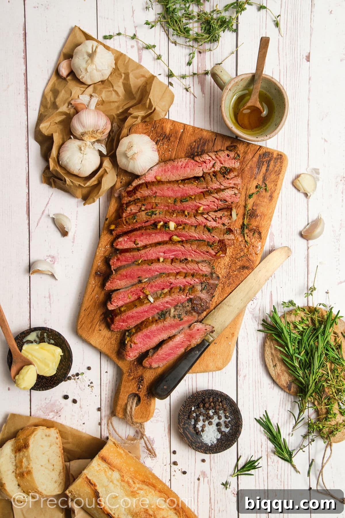 Flank steak cut against the grain, showing tender slices.
