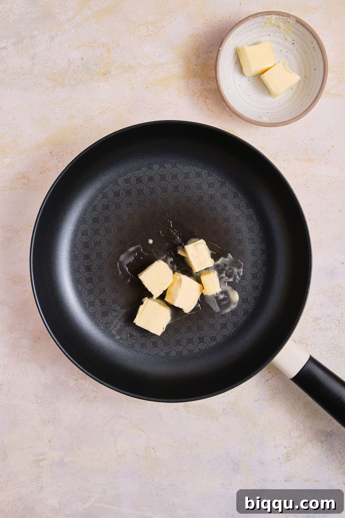 Zesty Lemon Garlic Butter Pasta 11 Butter melting in a large skillet over medium heat.
