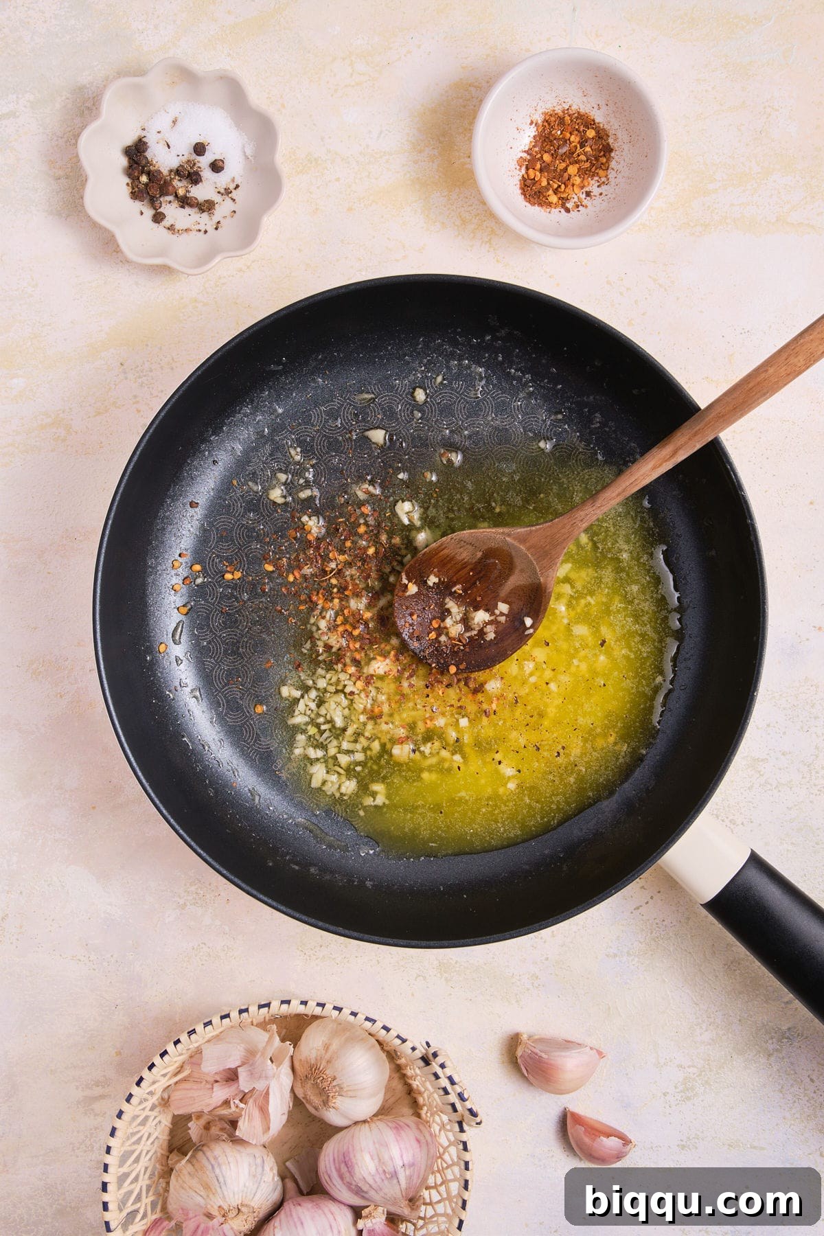 Zesty Lemon Garlic Butter Pasta 12 Minced garlic cooking gently in melted butter in a skillet.