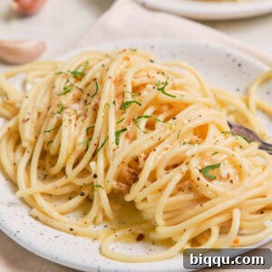 Lemon Garlic Butter Pasta on a speckled plate.