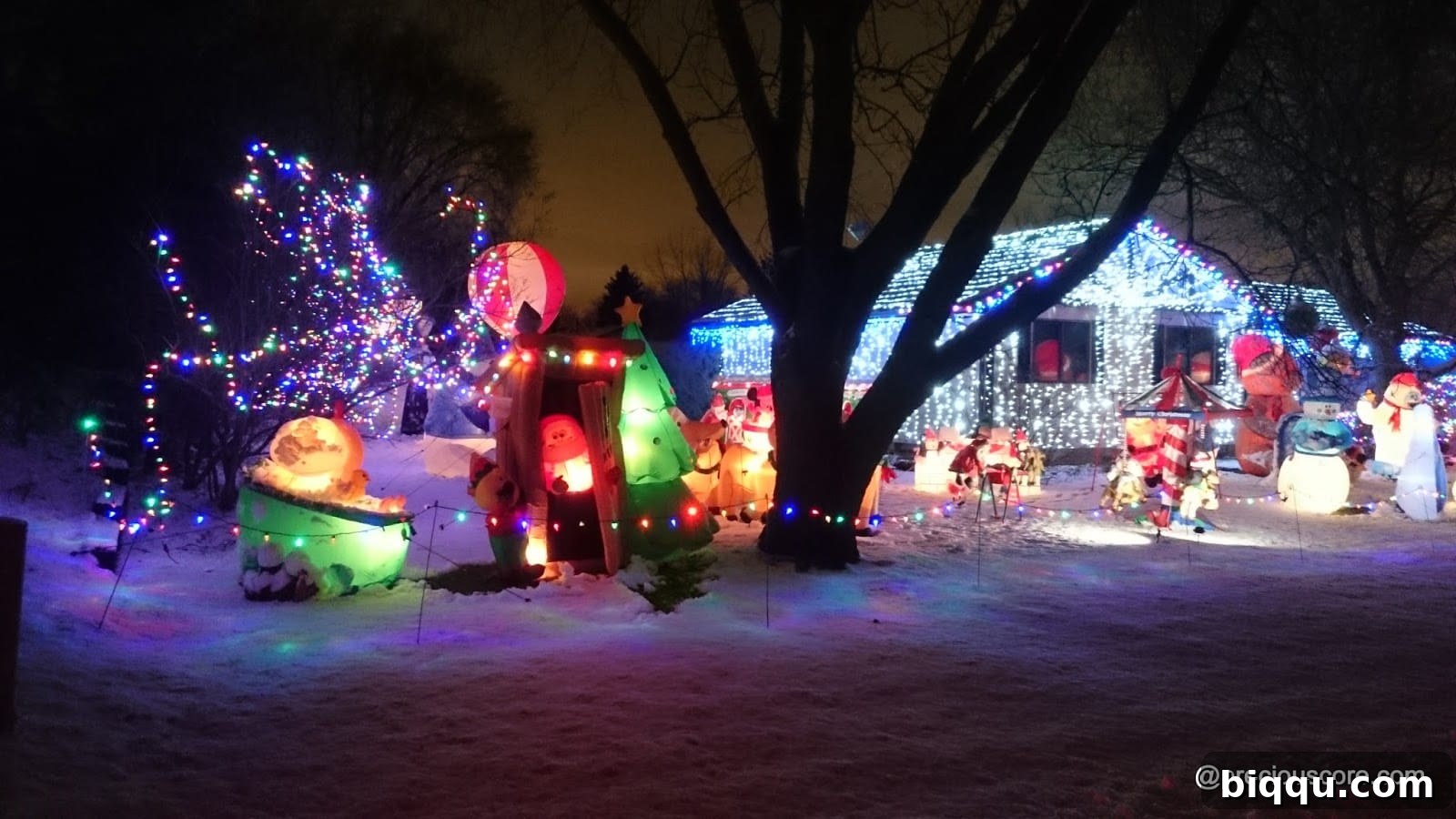 A charming house exterior decorated with elegant white Christmas lights