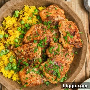Pan Seared Boneless Chicken Thighs with yellow rice.