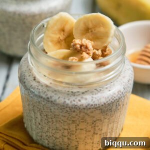 Close-up of a jar of banana chia pudding, ready for consumption.