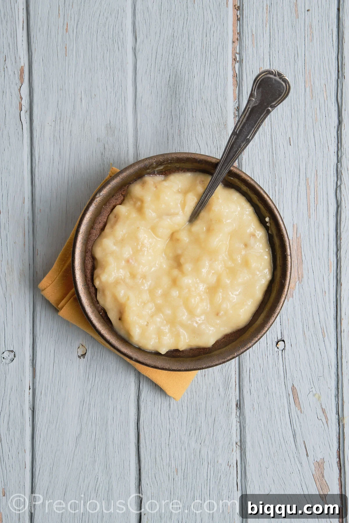 Mashed bananas in a bowl, showing a smooth, creamy texture.