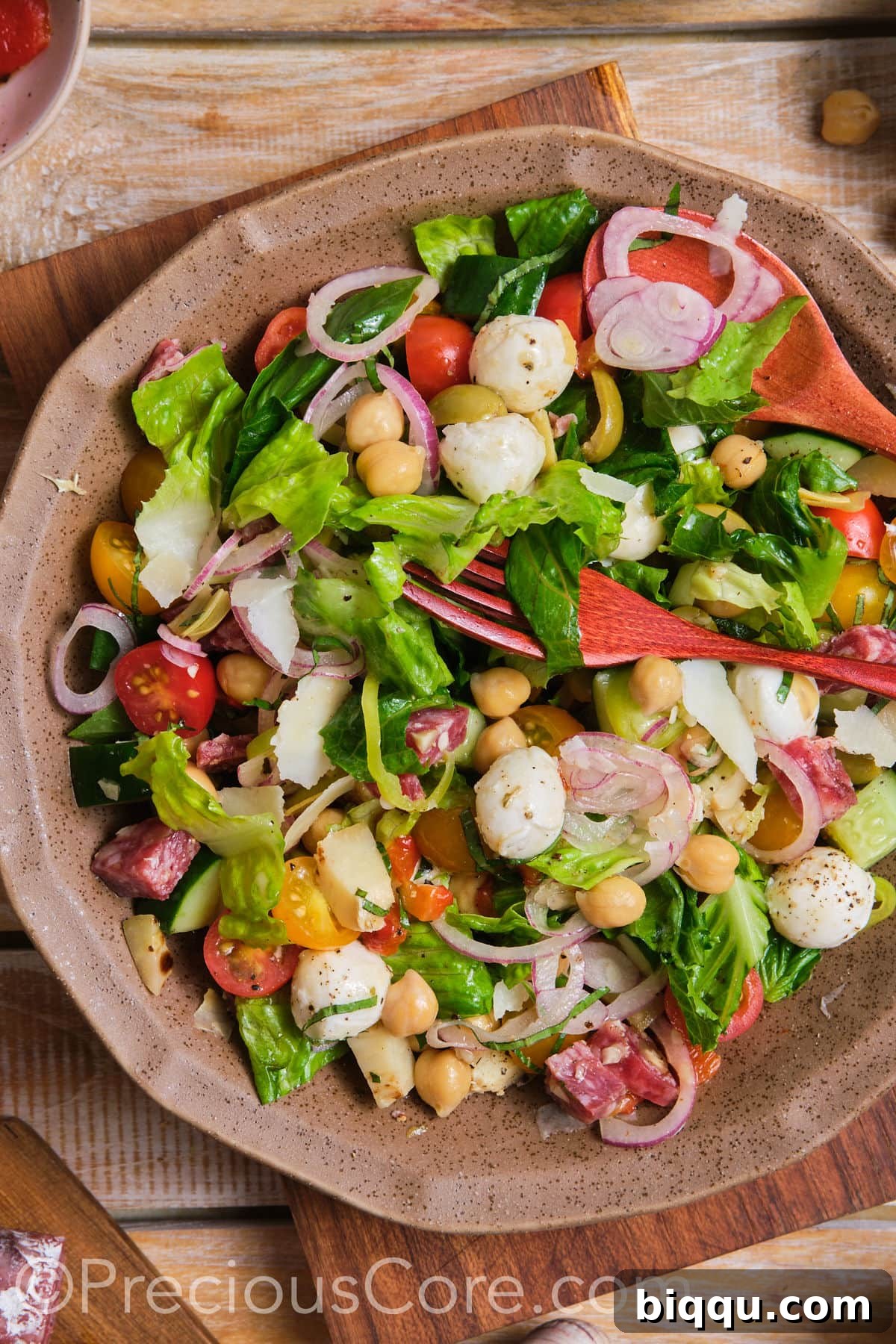 A beautifully arranged bowl of Italian chopped salad, showcasing its vibrant ingredients.