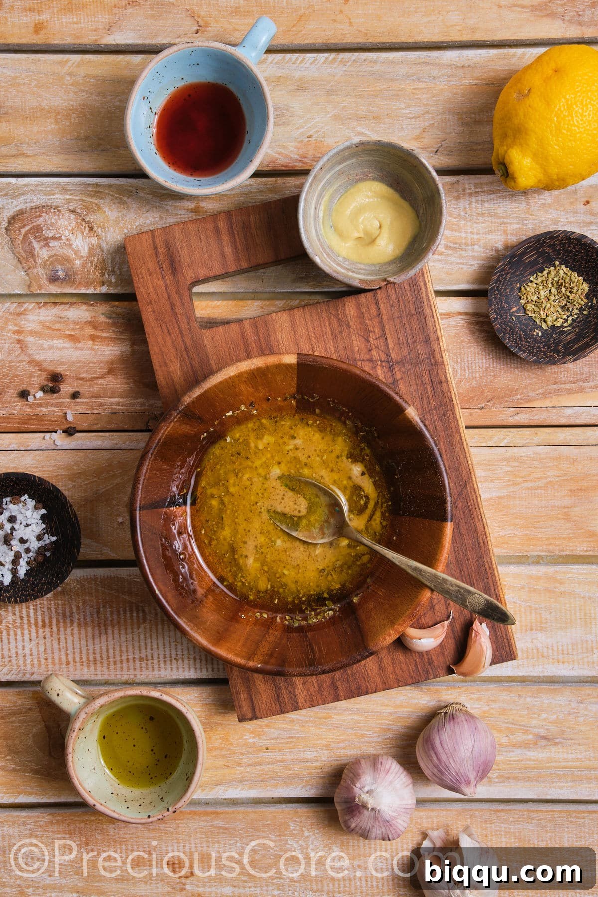 The perfectly mixed and emulsified salad dressing, shimmering with flavor.