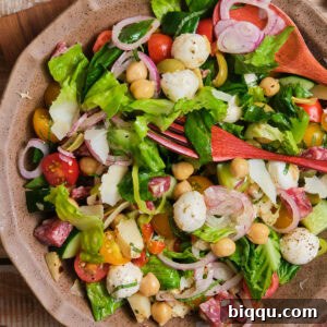 A large bowl filled with a colorful and appetizing Italian chopped salad.