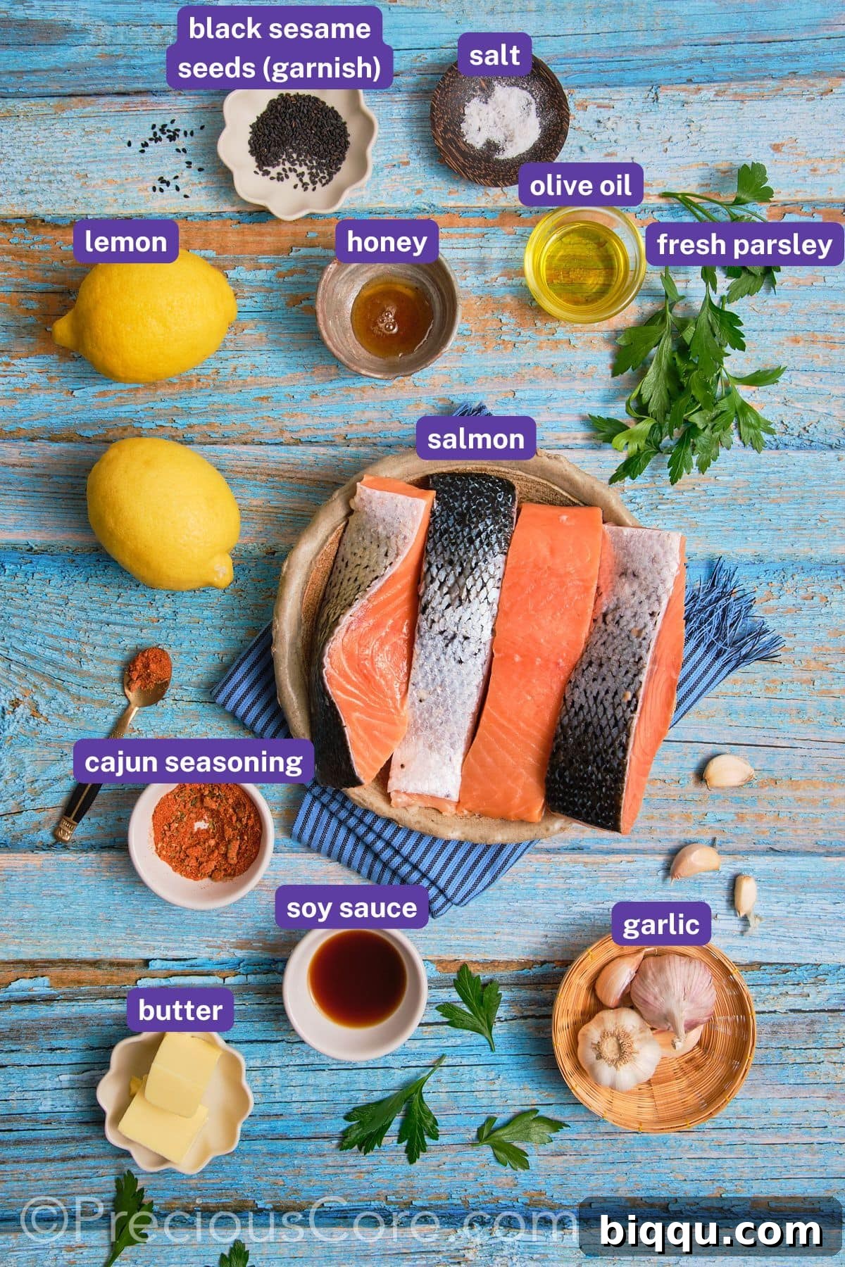 A vibrant flat lay showcasing all the fresh and pantry ingredients needed for Cajun Honey Butter Salmon, each labeled clearly.