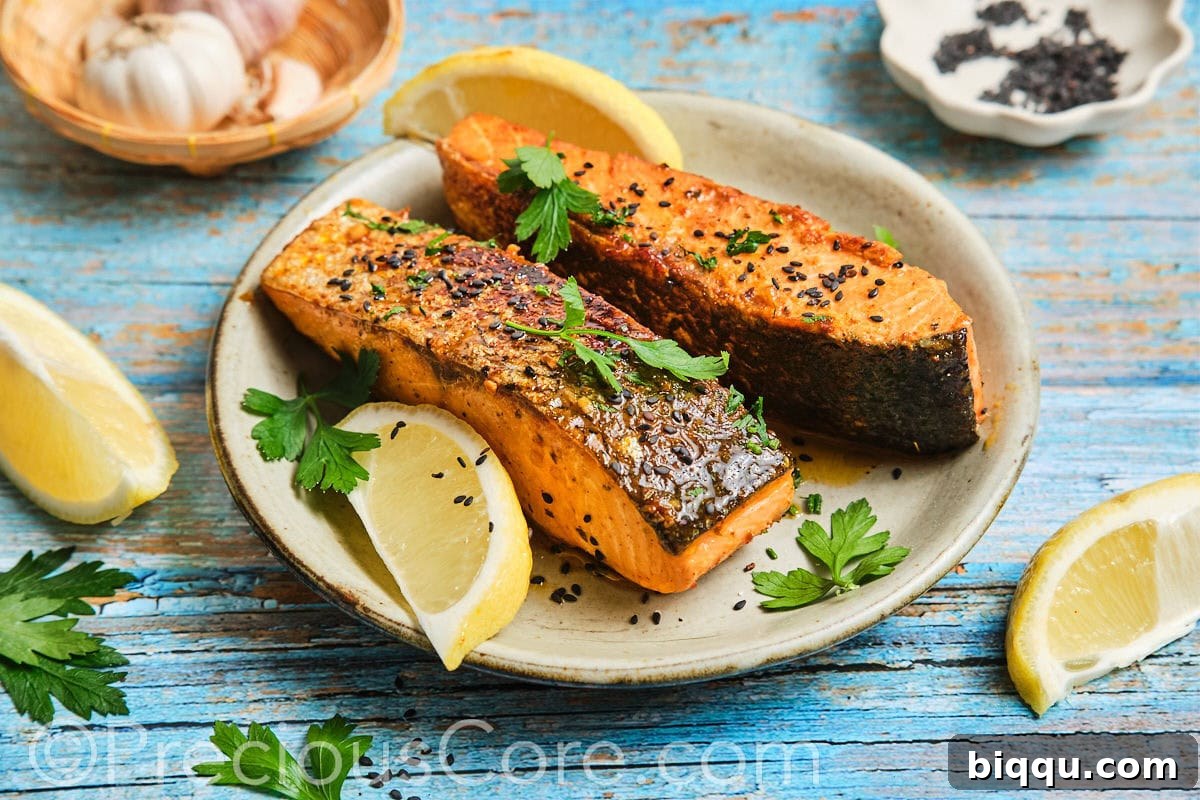 A perfectly seared and sauced Cajun Honey Butter Salmon fillet, presented beautifully in a landscape orientation.
