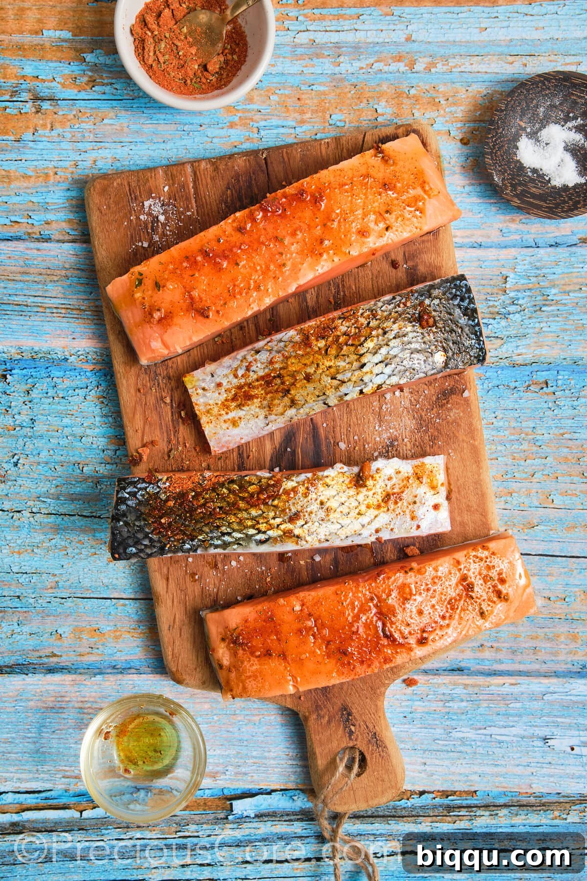 A salmon fillet beautifully coated with a generous layer of Cajun seasoning, ready for cooking.