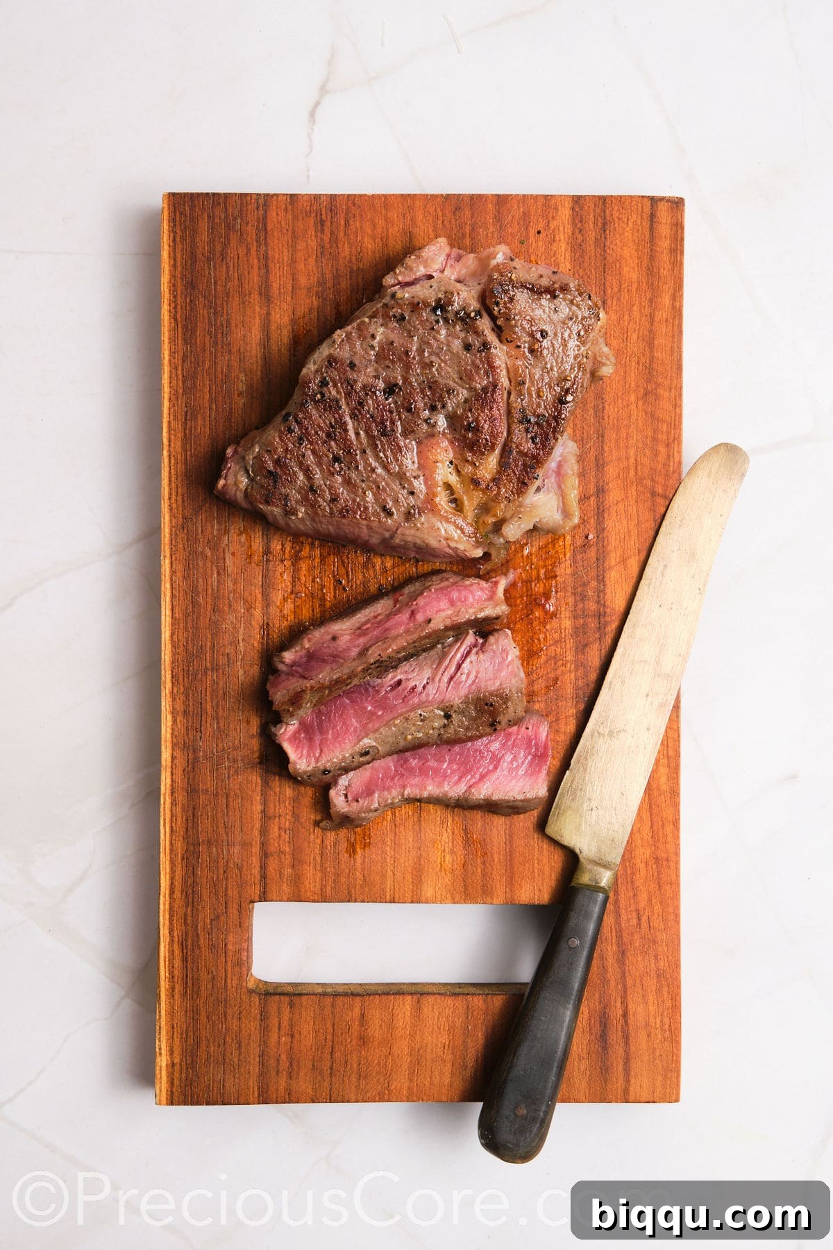 Slicing steak into thin strips.