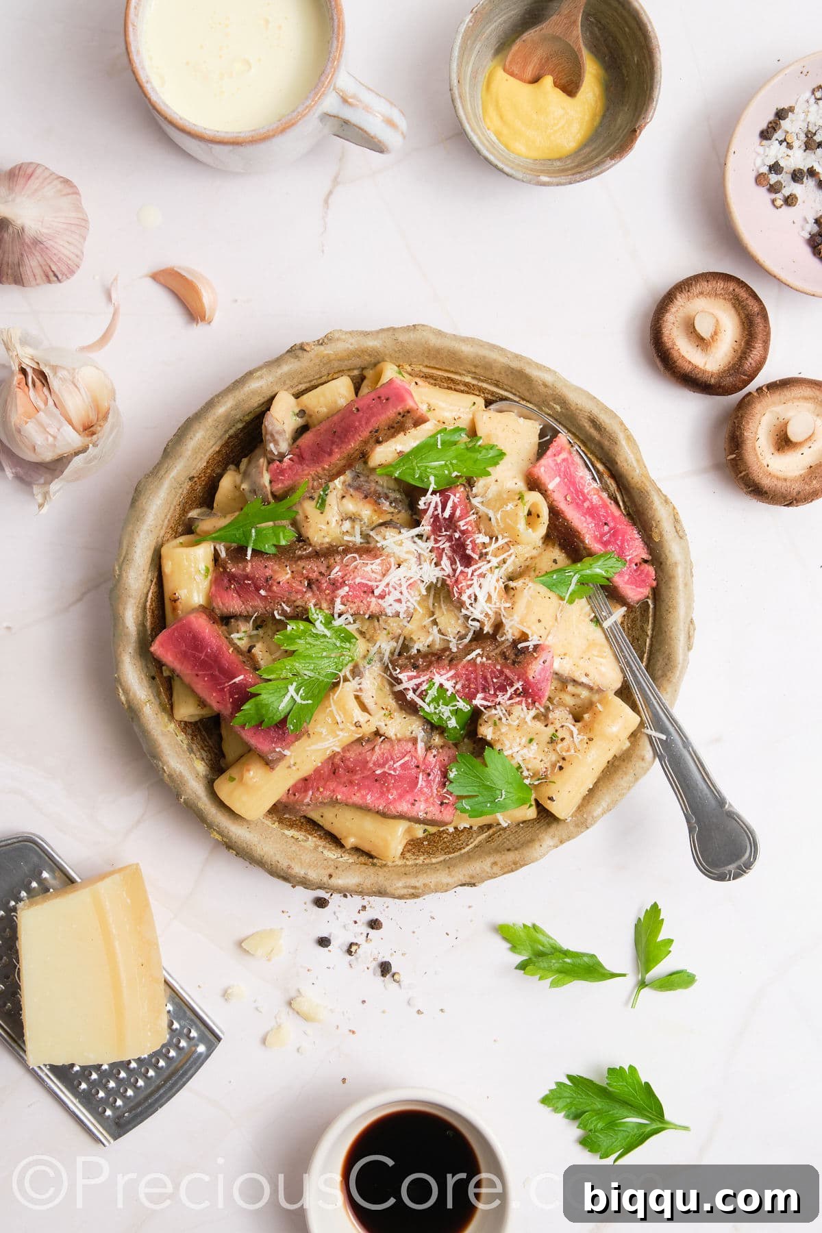 Pasta topped with grated parmesan.