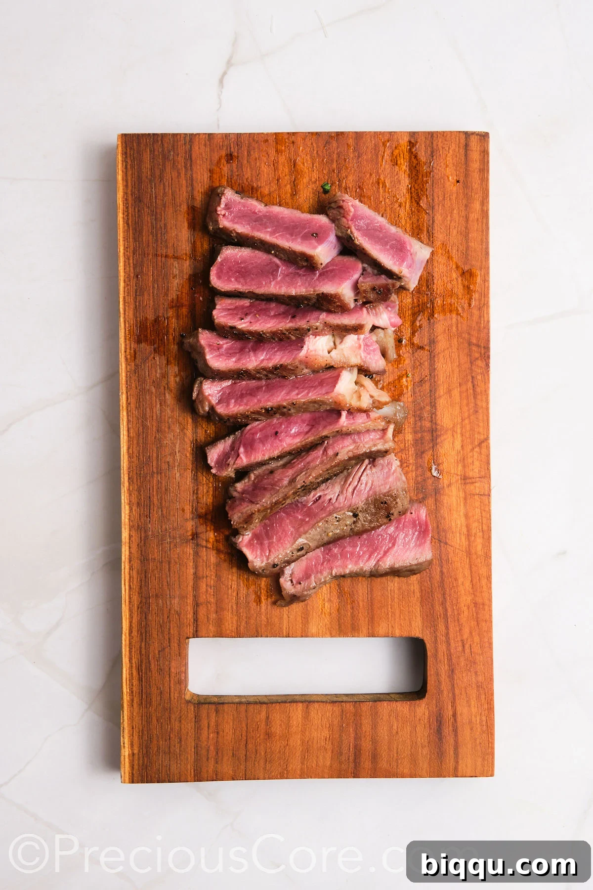 Steak sliced on a cutting board.