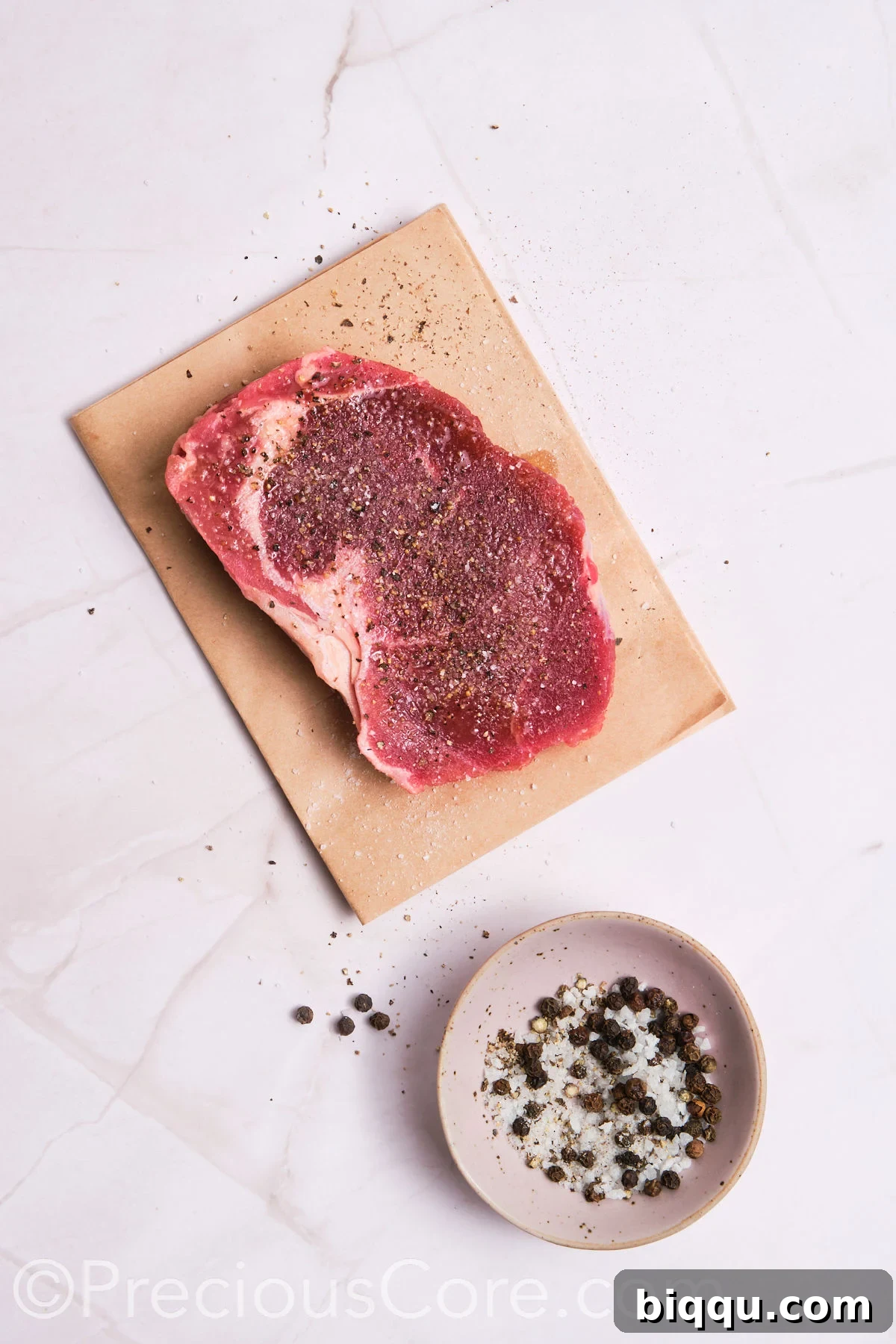 Steak seasoned with salt and pepper.