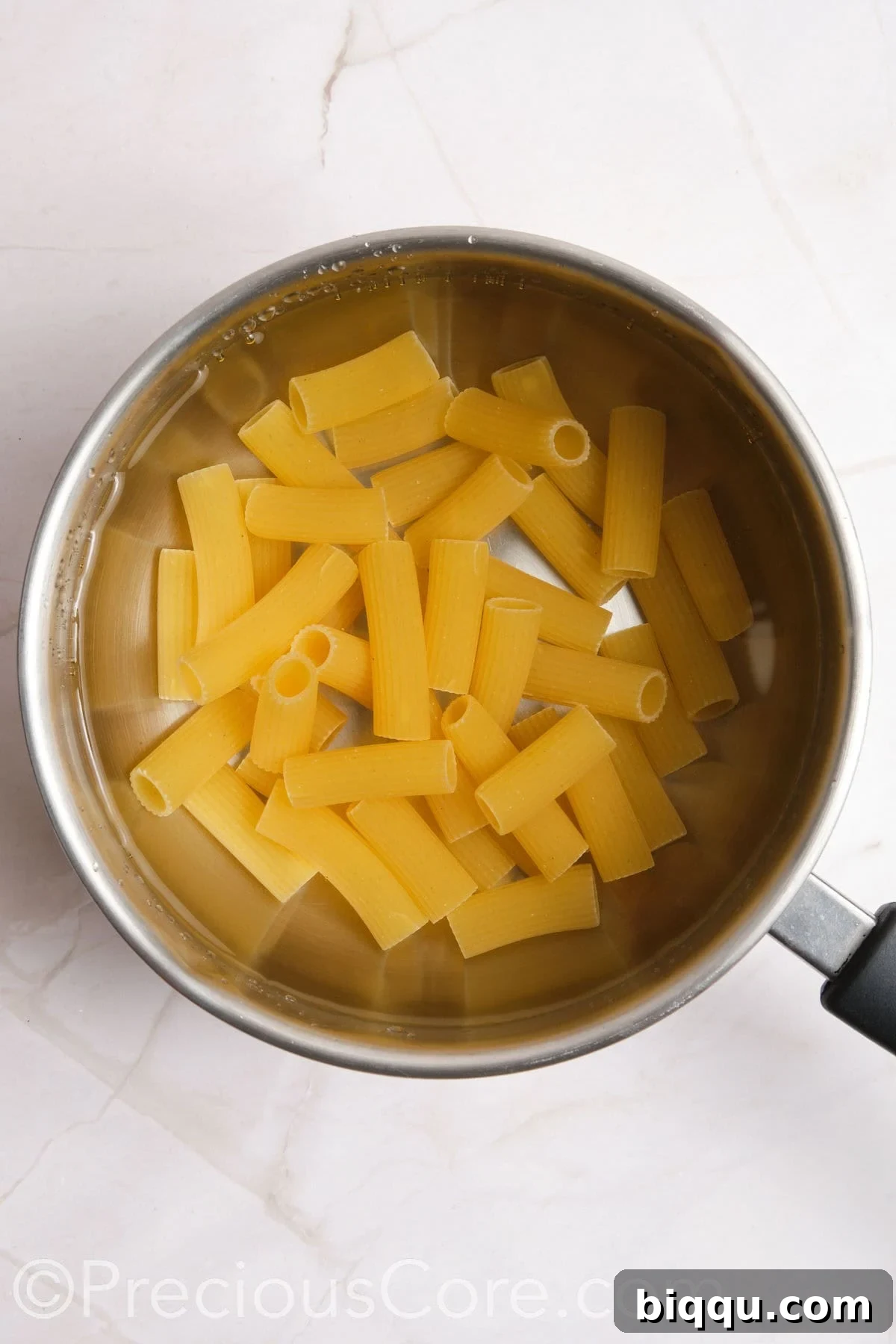 Pasta boiling in a pot of water.