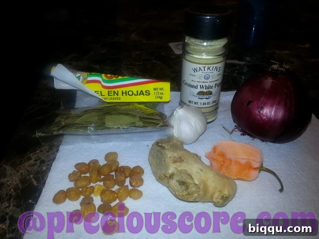Key ingredients for Pepper Soup, including Njansa nuts and other spices.