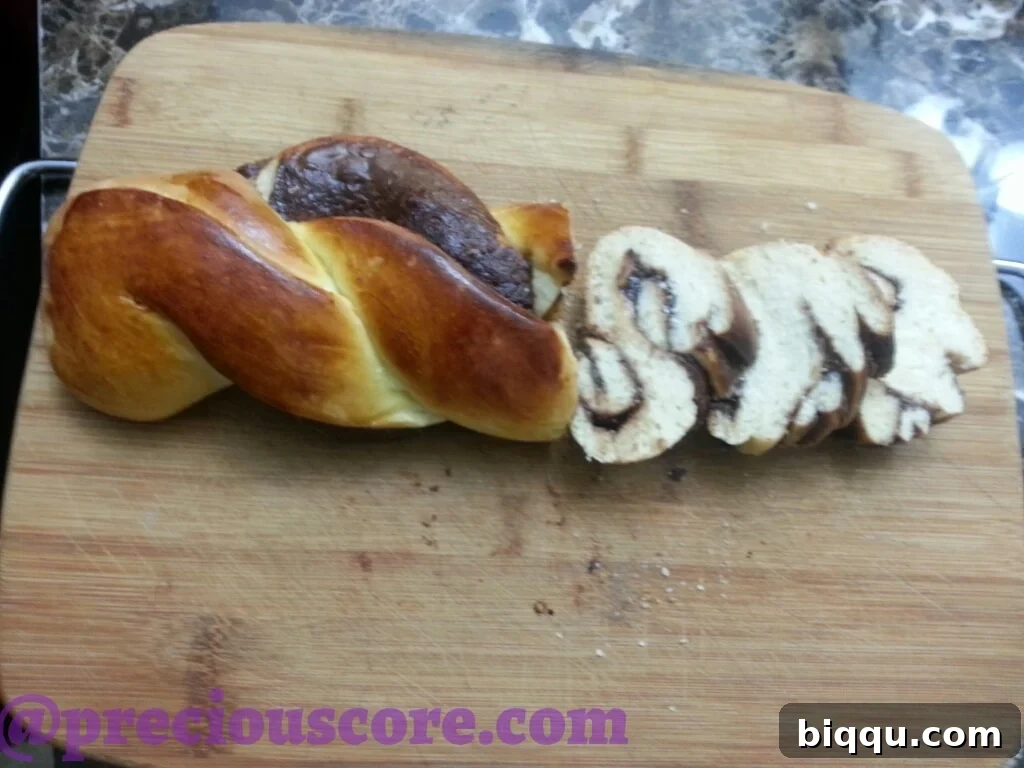 Hand reaching for a slice of Nutella bread
