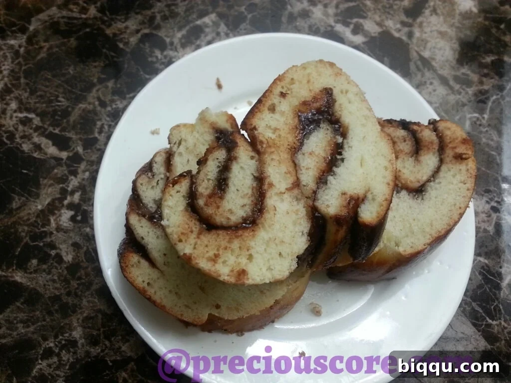 Hand holding a slice of Nutella bread