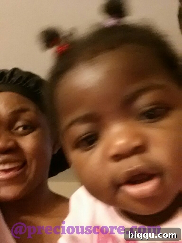 A blurry but endearing photo of a parent and child sharing a tender moment