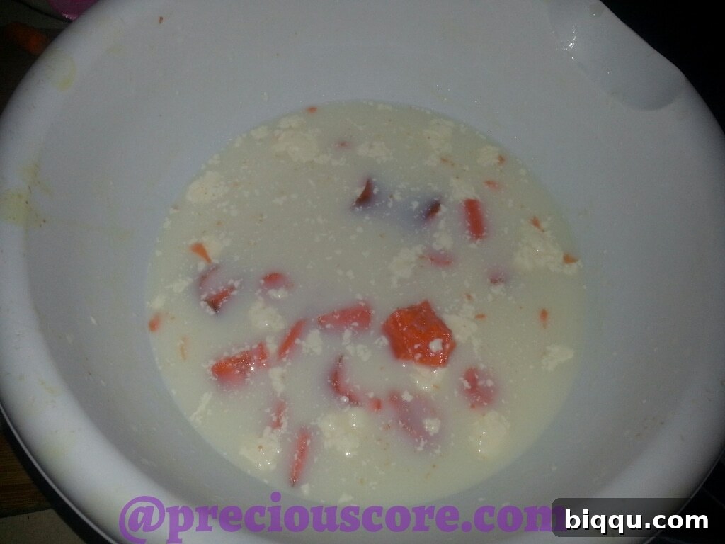 Children's homemade 'co slush' with haphazardly chopped carrots and creamy dressing