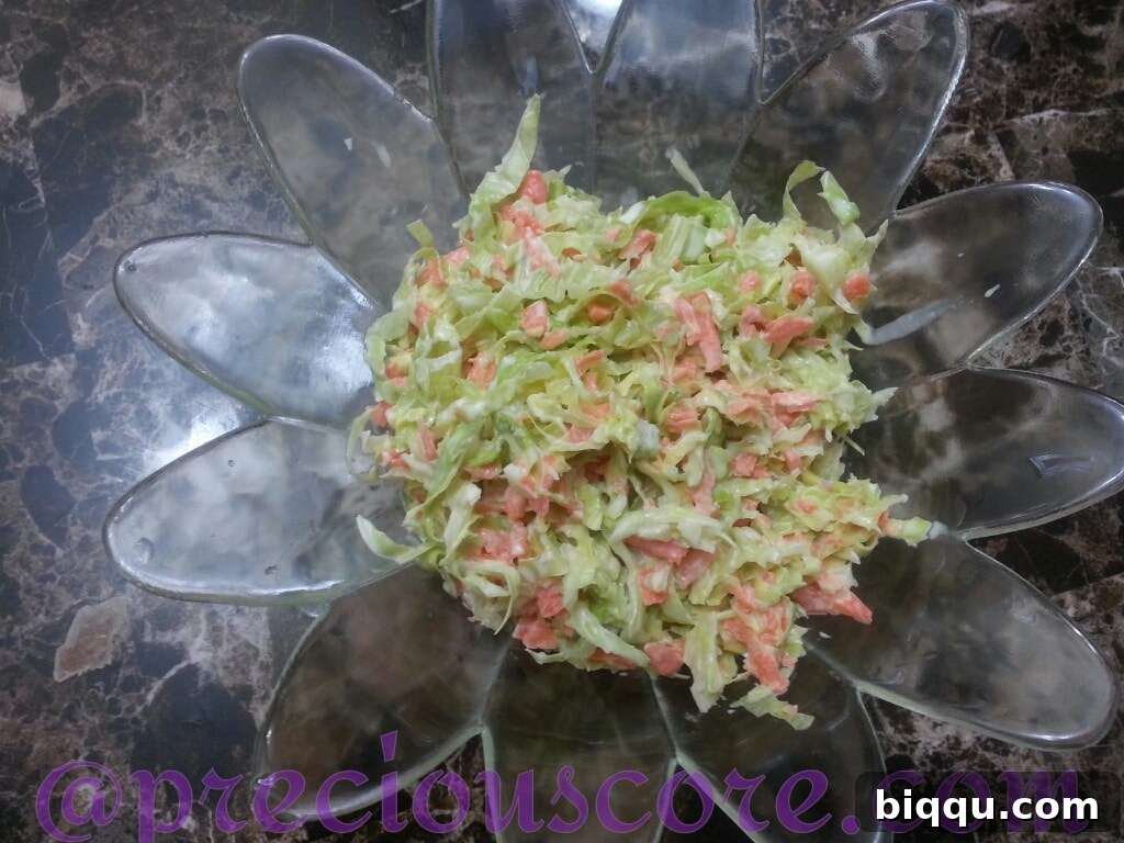Freshly made creamy coleslaw with finely shredded cabbage and carrots