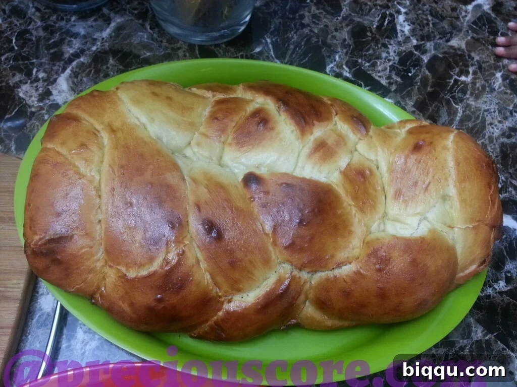 Golden-brown, freshly baked Challah bread loaf
