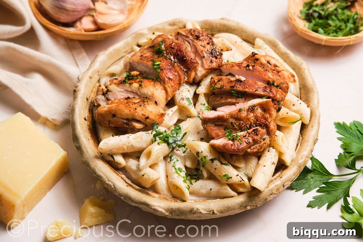 Landscape image of one pot creamy chicken pasta, showcasing its rich texture and ample serving size.