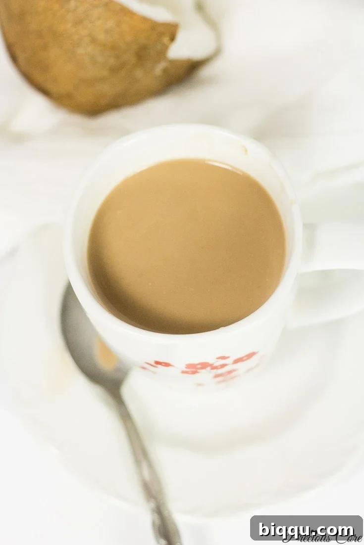 Close-up of a mug of healthy and creamy coconut hot chocolate, perfect for a cozy treat.