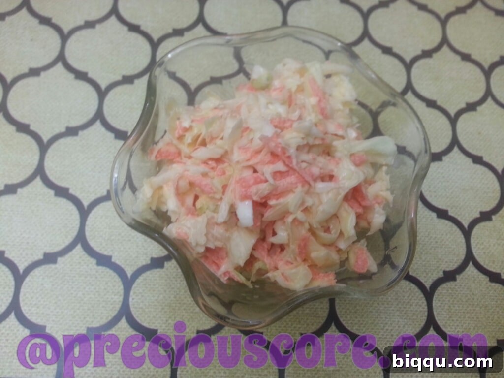 A bowl of fresh coleslaw, enthusiastically prepared by children