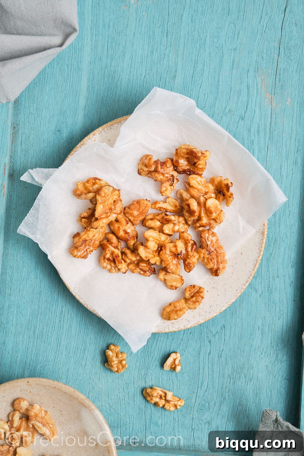 Walnuts placed on parchment paper to cool.