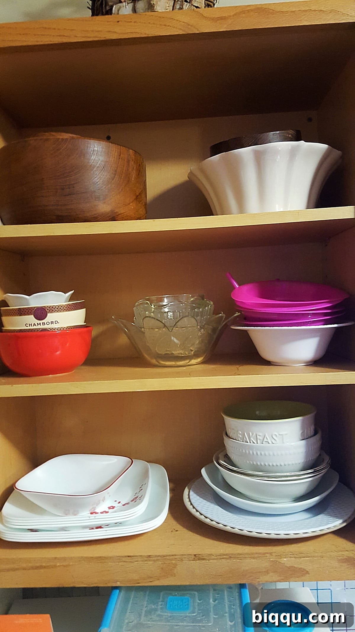 My Blueprint for a Beautifully Organized Kitchen 3 Neatly organized plates cabinet in a minimalist kitchen, showcasing simplified storage and ease of access after decluttering.