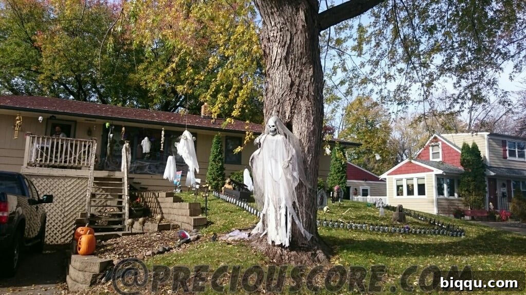 An eerie Halloween yard display with glowing elements.