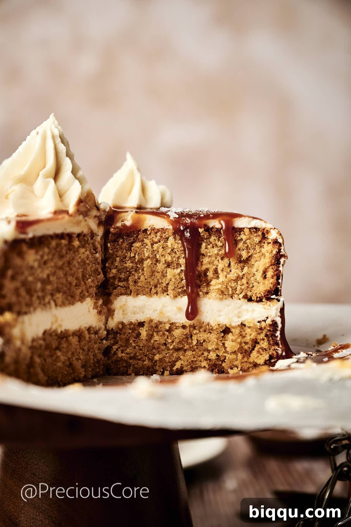 A beautiful slice of salted caramel cake, showcasing its moist crumb and even layers of frosting, ready to be enjoyed.
