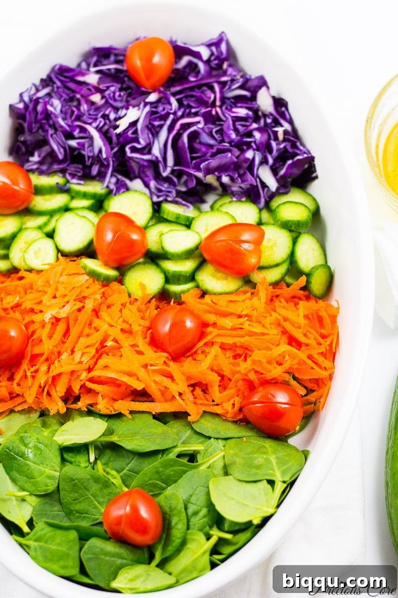 spinach cabbage salad with tomato hearts and honey lemon dressing