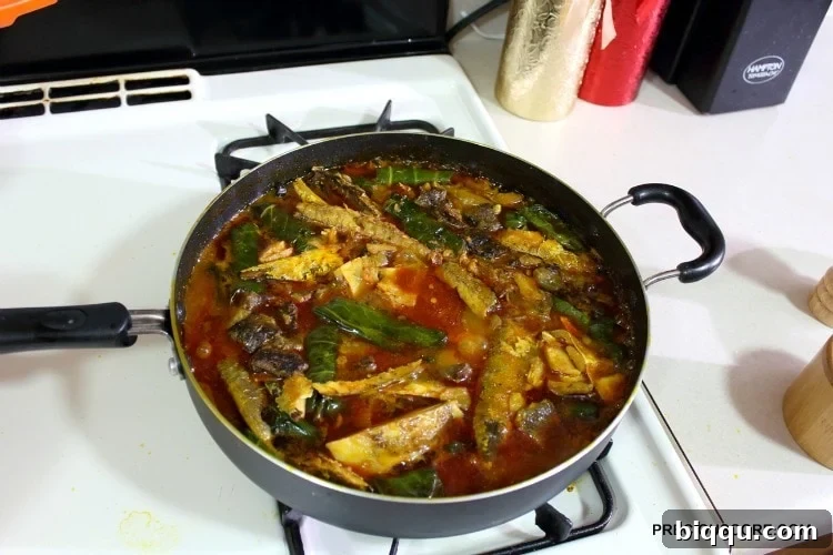 A pot brimming with cooked Ekwang, steam rising, indicating it's perfectly done and ready to be served.
