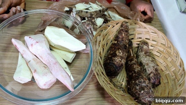 Bowls displaying both peeled and unpeeled 'macabo' cocoyams, ready for Ekwang preparation.