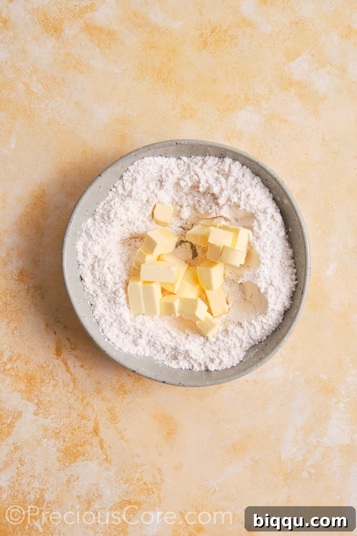 Dry ingredients and butter for pie crust in a bowl.
