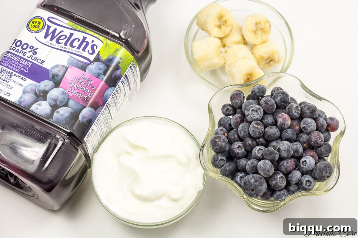 Ingredients for a 4-ingredient purple smoothie: frozen banana, blueberries, Greek yogurt, Welch's grape juice