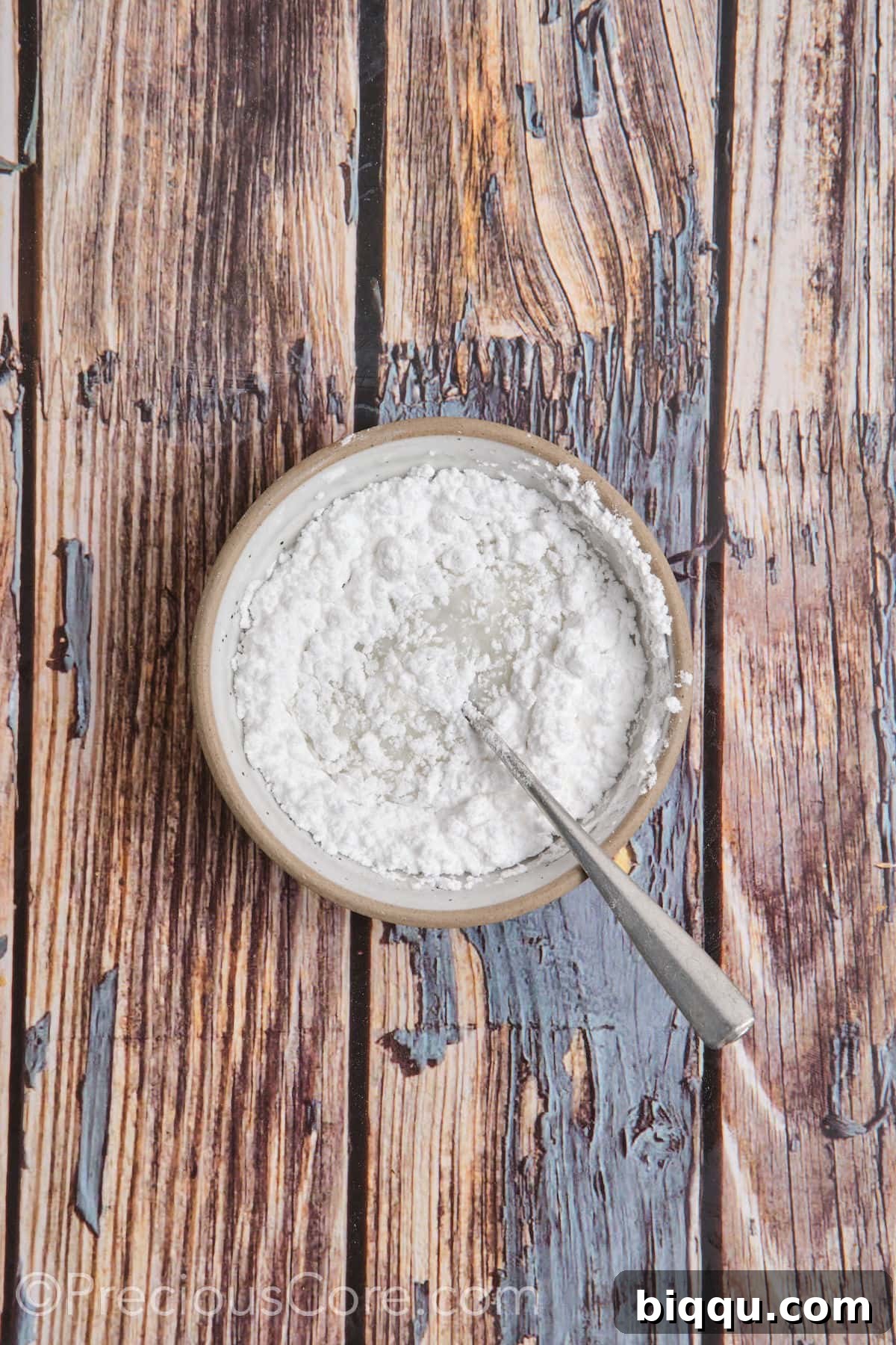 Preparing the simple two-ingredient glaze with powdered sugar and milk.