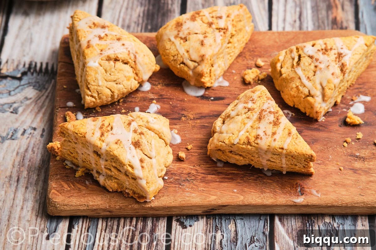 Delicious homemade sweet potato scones arranged on a wooden chopping board.