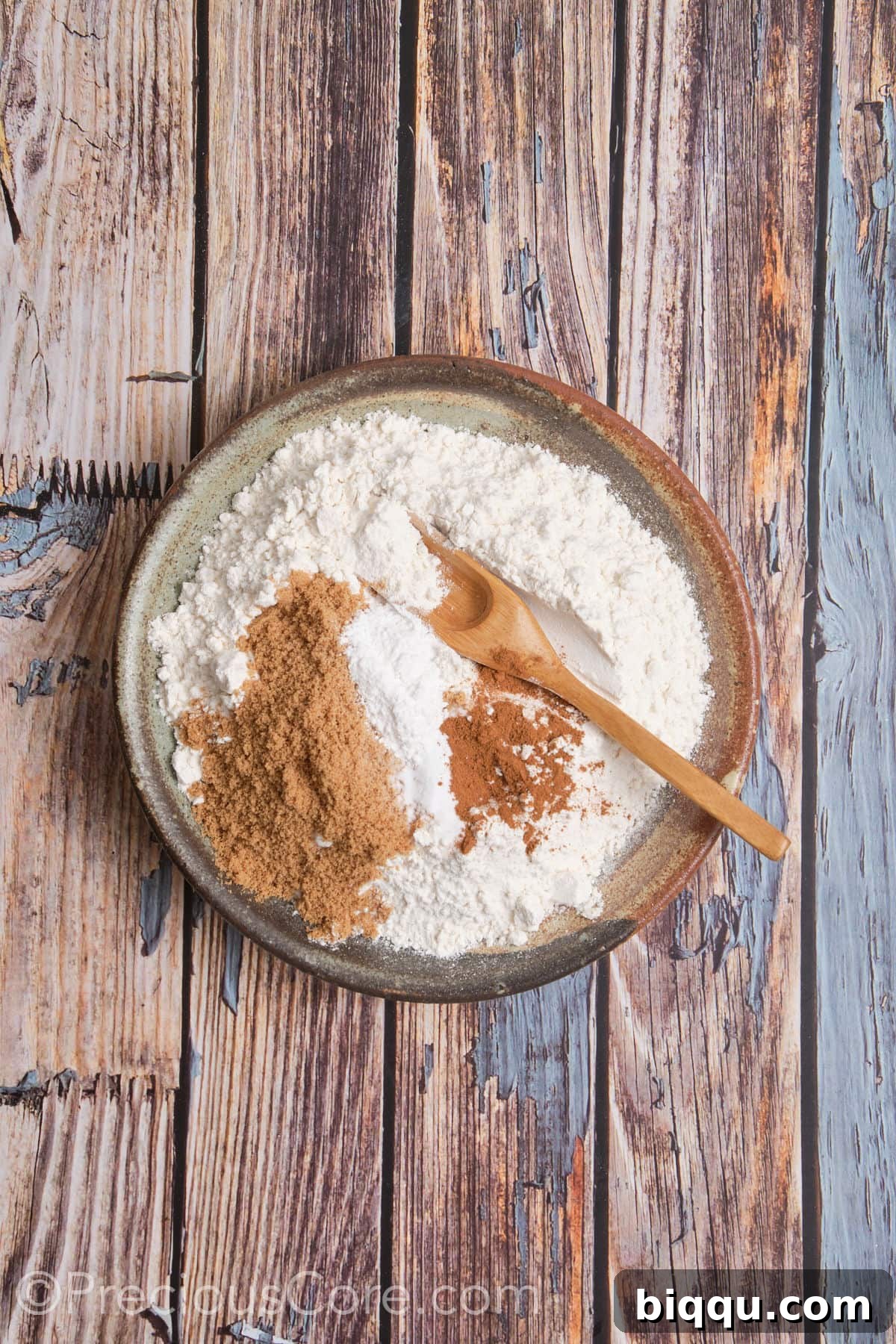 Mixing dry ingredients for sweet potato scones in a large bowl.