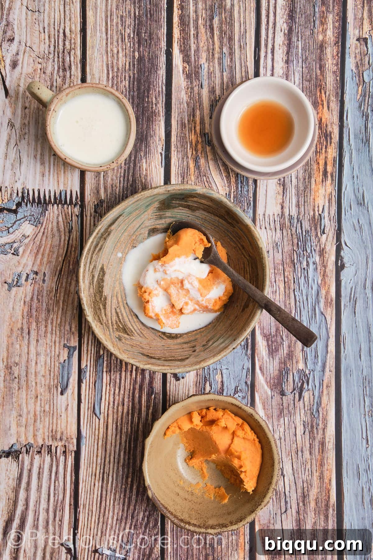 Mixing together wet ingredients for scones: mashed sweet potato, buttermilk, and vanilla extract.